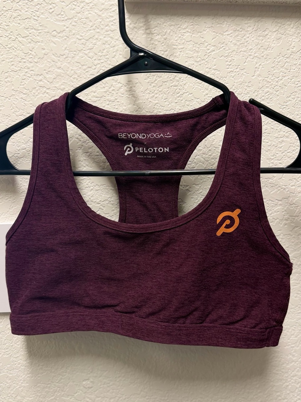 Beyond Yoga Women's Plum Racerback Sports Bra with Orange Peloton Logo